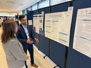 Manav Shah, Class of '26, with his research poster